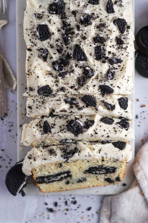 This next-level Oreo pound cake is made with a vanilla cake batter and cookie pieces with whole Oreo cookies hidden inside. Topped with a simple vanilla cream icing, it's perfect for cookies and cream lovers! Cookies And Cream Cookie Cake, Lemon Oreo Cake, Oreo Rolls, Oreo Pound Cake, Cookies N Cream Cake Recipe, Oreo Cake Recipe, Cookies And Cream Frosting, Oreo Desserts, Loaf Cake Recipes