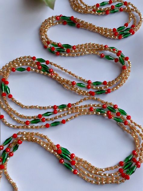 Single Strand Waist Bead "Ivory Coast", features a stunning combination of alternating brown and gold glass crystal beads with vibrant red and green crystal glass accents. Why You'll Love It: Rich Combination: Alternating brown and gold glass crystal beads create a harmonious and sophisticated look. Vibrant Accents: Red and green crystal glass bead accents add a lively pop of color and elegance. Perfect Fit: The adjustable single strand design ensures a comfortable and secure fit for all body types. Cultural Beauty: This piece reflects the rich heritage of Ivorian craftsmanship, blending traditional beauty with modern style. Color Significance: Brown: In Ivorian culture, brown symbolizes the earth, stability, and reliability. The brown beads ground the design, adding a natural touch. Gold: Crystal Waist Beads Design, Waist Jewelry, Belly Jewelry, Spring Sale, Ivory Coast, Gold Glass, Green Crystals, Vibrant Red, Bead Designs