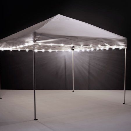 Enjoy your nights under the lights! Get your team spirit in high gear or set the mood for your cookout by lighting your tailgate canopy or patio umbrella. With 40 feet of lights that can be cut to size, there's plenty to fit a variety of canopy and umbrella sizes. These weather resistant lights come with clips to set them up and run on standard AA batteries (not included). We are dedicated to give everyone the very best houseware products for all home needs, with a focus on dependability, our cl Outdoor Umbrella Lights, Patio Umbrella Lights, Canopy Tent Outdoor, Umbrella Lights, White Canopy, Tent Lighting, Light String, Canopy Lights, Canopy Outdoor