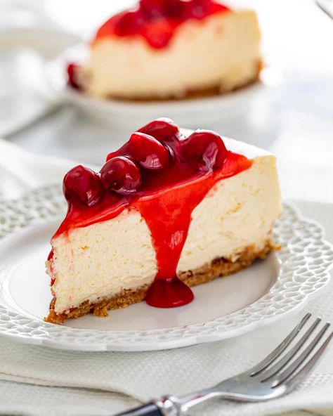 This Cheesecake Recipe is the only recipe you'll ever need for Cheesecake. A dreamy, decadent, rich, smooth and utterly delicious cheesecake topped with cherry topping! This really is what cheesecake dreams are made of! #cheesecake #recipe Plain Cheesecake, Cherry Topping, Easy No Bake Cheesecake, Jo Cooks, Retro Food, Baked Cheesecake Recipe, How To Make Cheesecake, Rich Desserts, Cherry Cheesecake