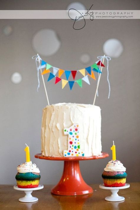 Over-The-Top First Birthday Cakes | Stay At Home Mum Bunting Cake, Rainbow First Birthday, Cake Bunting Topper, Cake Bunting, Rainbow Fabric, Twins 1st Birthdays, Circus Birthday Party, Sunshine Birthday, Cake Banner Topper