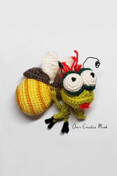 This is a crochet pattern post with step-by-step instructions on how to create Ray the Firefly from Disney's Princess and the Frog. The written pattern is only available to my Patreon subscribers but the video tutorial is available free on my YouTube channel. Ray The Firefly, Alligator Crochet Pattern, Frog Amigurumi, Disney Crochet Patterns, Double Crochet Decrease, Crochet Keychain Pattern, Crochet Decrease, Princess And The Frog, Crochet For Boys