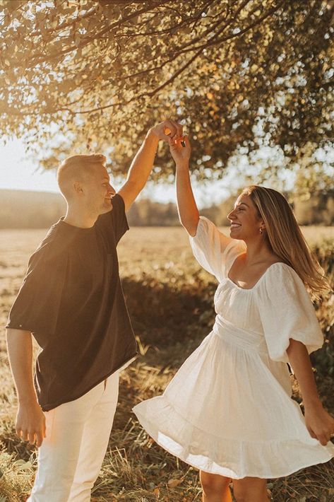 Couple holding hands outside at sunset/dusk Fall Engagement Photoshoot, White Dresses Online, Womens Summer Dresses, Engagement Photo Dress, Engagement Photo Outfits Fall, Cute Engagement Photos, Cute White Dress, Engagement Photos Fall, Engagement Photo Outfits