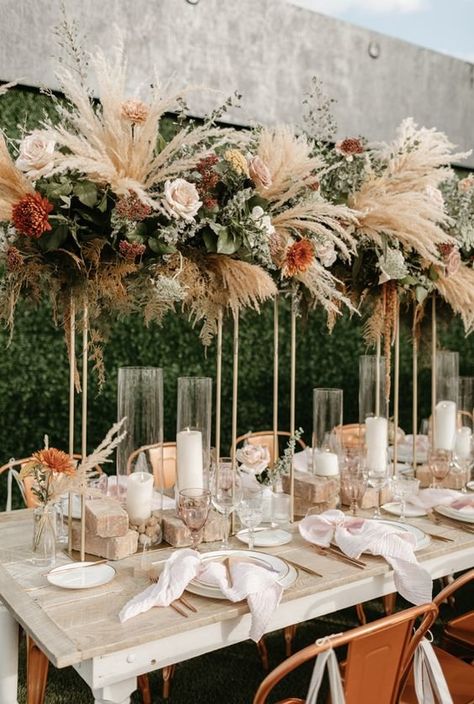 We've gathered 21 best wedding table decorations ideas to fit every wedding theme. From simple wedding table decor to elegant wedding table decor, we have got all. #shaadisaga #indianwedding #weddingtabledecor #weddingtabledecorround #weddingtabledecorrustic #weddingtabledecorsimple #weddingtabledecorboho #weddingtabledecorelegant #weddingtabledecorrosegold #weddingtabledecorminimalist #weddingtabledecorbeach #weddingtabledecorlong #weddingtabledecoroutdoor #weddingtabledecordiy #weddingtable Boho Chic Wedding Decor, Boho Centerpiece, Table Candles, Boho Wedding Centerpieces, Chic Wedding Decor, Table Rose, Tall Wedding Centerpieces, Table Layout, Reception Tables