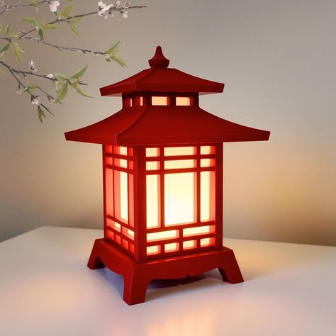 **Made by CapsuleCoInnovations (Original Creator and Owner - Only Authorized Seller Product Name:  3D-Printed Japanese Pagoda Lantern Desk Lamp Product Description: Envelop your workspace in a serene ambiance with our meticulously crafted 3D Printed Japanese Pagoda Lantern Desk Lamp. Inspired by the elegance of traditional Japanese pagodas, this exquisitely designed lamp seamlessly blends cultural heritage with modern functionality, providing both illumination and an artistic essence to your des