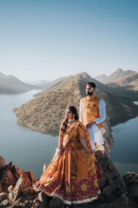 Immerse yourself in hilltop romance with this aesthetic engagement photography capturing stunning views. Against the backdrop of rolling hills, the couple's love shines brightly, creating unforgettable moments of joy and anticipation. | UDAIPUR RAJASTHAN | HilltopRomance | AestheticPhotography | EngagementSession | OutstandingViews | LoveAndAnticipation | ScenicBeauty | Bahubali Hills Udaipur, Indian Photography, Indian Wedding Couple, Wedding First Look, Pre Wedding Poses, Indian Wedding Photos, Romantic Bride, Udaipur, Wedding Photos Poses