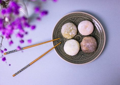 Traditional Japanese dessert mochi in rice dough on gray plate, food chopsticks. royalty free stock photography Rice Dough, Plate Food, Grey Plates, Japanese Dessert, Stock Photography Free, Food Plating, Chopsticks, Traditional Japanese, Mochi