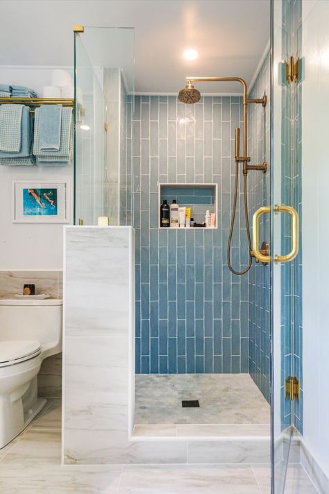 The ocean blue shower tile is Roman Skyline from Daltile, while the shower floor tile is a mosaic hexagon tile from Home Depot. Photo: Aaron K. Yoshino Blue Shower Tile, Blue Bathroom Tile, Bathroom Shower Walls, Shower Floor Tile, Master Shower, Bathroom Redesign, Contemporary Coastal, Blue Tile, Bathroom Remodel Shower