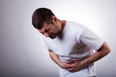 Man with stomachache. Young man with severe stomachache holding his stomach , #Ad, #Young, #stomachache, #Man, #man, #stomach #ad Stop Acid Reflux, Stomach Cramps, Stomach Ulcers, Liquid Diet, Stomach Ache, Stomach Acid, Stomach Pain, Chronic Disease, Acid Reflux