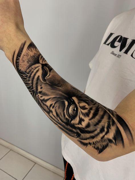 #tigertattoo #tigretattoo #animaltattoo #tattoogirls #tattooman #tattoomodels #eyestattoo #realistictattoo #blackandgrey Tiger Stripe Tattoo, Stripe Tattoo, Tiger Eyes Tattoo, Cheetah Tattoo, Octopus Tattoo Sleeve, Lion Forearm Tattoos, Tiger Tattoo Sleeve, Lion Tattoo Sleeves, Last Kingdom