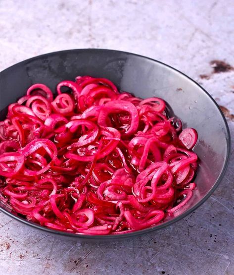 Try this no cook recipe for quick pickled red onions once, and you'll be hooked! 4 basic ingredients, a quick onion massage, and an hour of marinating time makes the best pickled onion side dish ever!I've added to my quick pickle recipes with Mexican Escabeche vegetables and the lime pickled onions I use for Mexican black bean dip, but this red onions recipe continues to be a most-requested condiment. It's been added to many home cook menus throughout the years. Add a vibrant blast… Onion Ideas, Onion Side Dish, Vegan Chickpea Burger, Quick Pickle Recipe, Quick Pickle, Red Onion Recipes, Quick Pickled Red Onions, Pickled Onion, Pickle Recipes