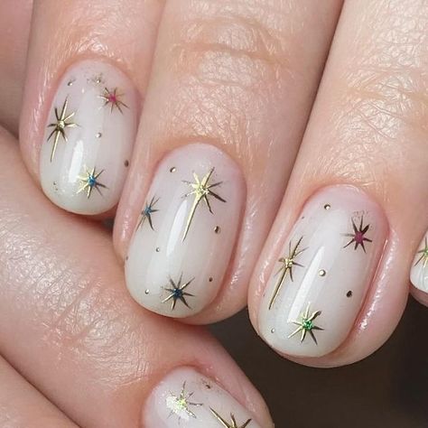 @ashley_thatnailbabe on Instagram: "Twinkle twinkle little star…. ✨🌙  Prep |  @officialnavyprofessional  @willowacademy_lj   Created using | @the_gelbottle_inc   Topped with @lunuluxe | Velvet Bloom  #nails #nailtech #buildergel #thegelbottleinc #navyprotools #nailart #naturalnails #buildergel #handdrawnnailart #naileditbyashley #ilovemyjob #nailsuite #nailsofinstagram #navyprotools #naileditbyashley #nailroom #nailedit #britishmanicure #navytools #navyprep #nailsmagazine #nailpromagazine" Short Nails Celestial, Silver And Gold Star Nails, Solstice Nails Winter, Winter Star Nails, Christmas Nails Star Of Bethlehem, Gold Star Nails Short, Star Nails Christmas, Star Of David Nails, Glittery Star Nails