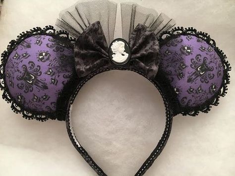 Custom fabric ears with special trims. Ornate velvet trim around the base of the ears. Cameo button in center of 2 layered bow. These Haunted Mansion inspired ears are some of my favorites to date. :) Wallpaper Minnie Mouse, Ear Inspiration, Mansion Wallpaper, Ear Ideas, Haunted Mansion Wallpaper, Diy Disney Ears, Disney Ears Headband, Diy Mickey Ears, Layered Bow