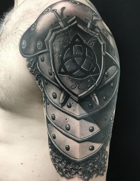 Celtic shield with two daggers tattoo Armour Tattoo Design, Shoulder Armor Tattoo Design, Armor Sleeve Tattoo, Shoulder Piece Tattoo, Armour Tattoo, Tattoo Designs With Meaning, Shoulder Armor Tattoo, Body Armor Tattoo, Designs With Meaning