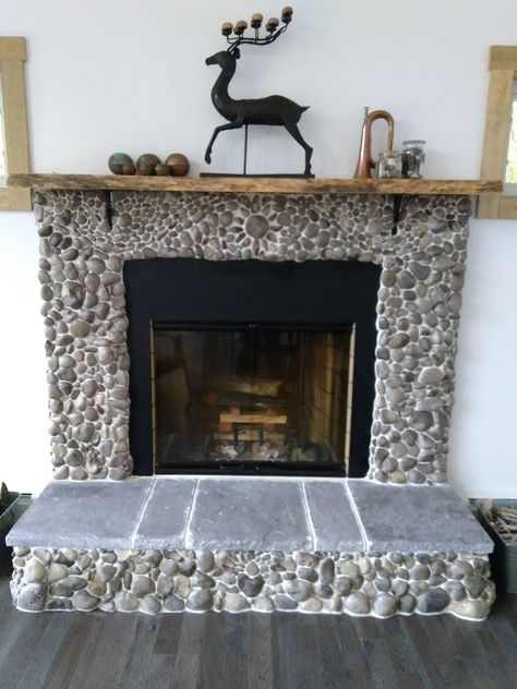 Did it myself! Petoskey Stone Fireplace Pebble Stone Fireplace, Pebble Fireplace, Petoskey Stone Crafts, Petosky Stone, Fireplace Tile Surround, Pebble Tile, Petoskey Stone, Rock Fireplaces, Rock And Pebbles