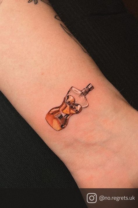 Micro realistic tattoo of Jean Paul Gaultier's Classique perfume bottle done by Romulo at No Regrets Tattoo Studio Cheltenham Tattoo Perfume, Perfume Bottle Tattoo, Regrets Tattoo, John Paul Gaultier, No Regrets Tattoo, Bottle Tattoo, Lyric Tattoos, Bad Tattoos, Funny Tattoos