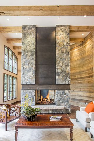 Fireplace - stone with ibeam and metal accent Metal And Stone Fireplace, Rustic Contemporary Fireplace, Indoor Rock Fireplace, Freestanding Stone Fireplace, Two Story Fireplace With Tv, Modern Stacked Stone Fireplace, Metal Fireplace Wall, Stone And Tile Fireplace, Modern Stone Fireplace Ideas