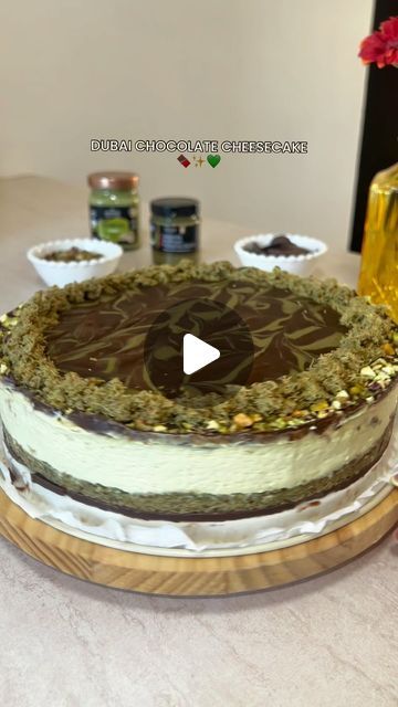 EatOutCyprus on Instagram: "DUBAI CHOCOLATE CHEESECAKE🍫✨💚

For the chocolate ganache: 
300 gr chocolate
40 gr unsalted butter (optional see tip below)

For the base: 
500 gr kataifi pastry
125gr unsalted butter
300gr pistachio cream @alphamegacy 

For the cream: 
600 gr cream cheese 
200 ml whipping cream
200 gr melted white chocolate 
2 tbsp icing sugar 
250 gr pistachio cream
(Let it cool in the fridge for at least an hour)

For the decoration: 
50 gr crushed pistachios 
50 gr pistachio cream 
leftover kataifi base 

Tip: Butter will turn the ganache rich and shiny but also turn the liquid stiff. To fix the seized chocolate, add a splash of whole milk or whipping cream and whisk for a minute. This will help and give a more melt in the mouth texture ⭐️

#recipe #dubaichocolate #cheeseca Dubai Cheesecake Recipe, Dubai Chocolate Cheesecake, Chocolate Cheesecake Decoration, Dubai Chocolate Cake, Pistachio Cheesecake Recipe, Dubai Cake, Kataifi Pastry, Crushed Pistachios, Cheesecake Decoration