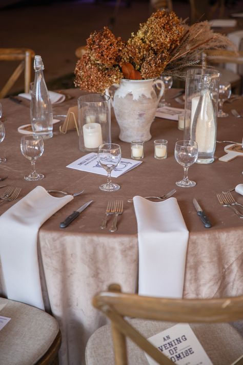 Fall hues and textures combined for a neutral yet autumnal reception table arrangement! A tawny velvet table cloth combined with cream napkins and natural grasses and florals created a simplistic yet trendy look! https://lovelessevents.com/ Cream Table Cloth Wedding, Tan Table Cloth Wedding, Taupe Wedding Table Linens, Cream Table Cloth, Beige Satin Tablecloth Wedding, White Table Cloth Tan Napkin Wedding, Taupe Linen Tablecloth Wedding, Cream Napkins, Velvet Table Cloth