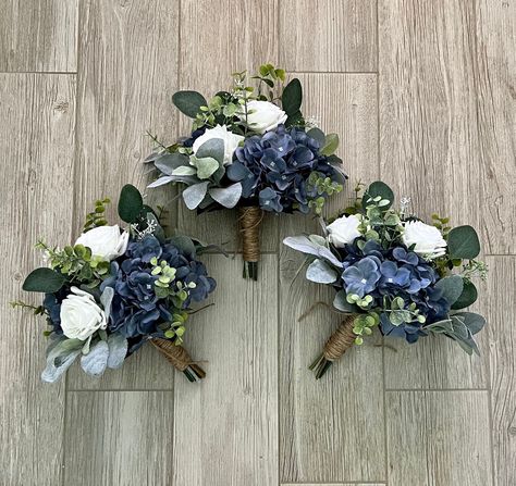 "Boho bridesmaid bouquet, dark dusty blue hydrangea premium white roses & greenery bridal , steel smokey blue, eucalyptus sage wedding  🌿This hand tied is made with real touch and silk flowers. Designed as a loose, Boho, garden style wedding bouquet , we use high quality flowers and greenery including roses, eucalyptus, Seeded eucalyptus, hydrangea, lambs ear  🌿As Shown; Bridal 13-14\"  Bridesmaid 9-10\" (set of 3 pictured) Extra large bridal 15\" Cake flowers 8\" Hair comb 7\" 🌿The bouquet p Navy And Green Bouquet, Colorful Wedding Bouquet With Eucalyptus, Bridesmaid Bouquet Navy Blue, Sage And Navy Bouquet, Green And Blue Wedding Bouquets, Sage Green And Navy Blue Wedding Bouquets, Wedding Flowers Blue And Green, Sage Green And Navy Blue Wedding, Navy Blue And Sage Green Wedding