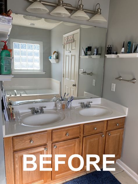 "The master bath as it is currently has a double-sink vanity and a toilet on one wall (the two divided by a privacy wall) and a jetted tub and small standing shower on the other. For the first part of our bath remodel, we want to replace the vanity and mirror." | Stay tuned to see Mary Kate's process of renovating her Master Bathroom with Home outlet Double Vanity Remodel Ideas, Cabinet Between Bathroom Sinks Double Vanity, Bathroom Remodel 2 Sinks, Double Sink Vanity One Mirror, Two Sink Mirror Ideas, Bathroom Mirrors Double Sink, Double Vanity With Shelf In Middle, Double Vanity Two Mirrors, Small 2 Sink Vanity Master Bath