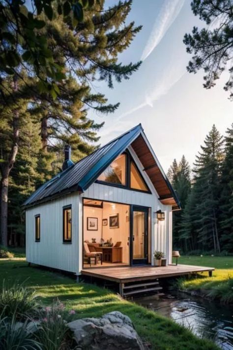 Discover the charm of tiny house living with these beautiful exterior design ideas. From modern to rustic, find inspiration to create your perfect tiny home. Click to explore more! #GoTinySpace #TinyHouseExterior Tiny House In Mountains, Tiny Home Mountains, Black And White Tiny Home Exterior, Tiny Home With Lots Of Windows, Airbnb Exterior, Tiny House Large Windows, Interior Design Fails, Tiny House Exterior Ideas, Tiny Home Big Windows