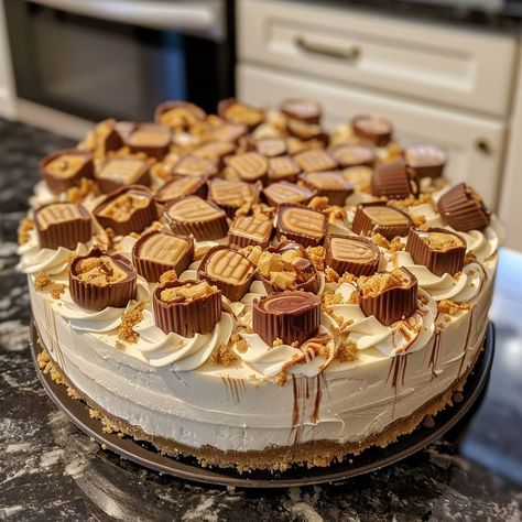 🍰 Indulge in a decadent White Chocolate Reese’s Cup Cheesecake! #DessertHeaven 🍽️ White Chocolate Reese’s Cup Cheesecake 🛒 Ingredients: 200g crushed graham crackers 100g melted butter 300g white chocolate chips 500g cream cheese 200ml heavy cream 100g sugar 200g Reese's Peanut Butter Cups, chopped 1 tsp vanilla extract 👩‍🍳 Instructions: Base: Mix crushed graham crackers with melted butter and press into a springform pan. Filling: Melt white chocolate; blend with cream cheese, heavy cream,... Reeses Cheesecake, Cup Cheesecake, Reese's Peanut Butter Cups, Instagram Recipes, Twisted Recipes, Melting White Chocolate, Reeses Peanut Butter Cups, Reeses Peanut Butter, Trending Recipes