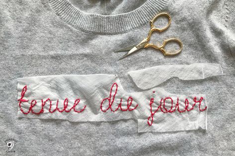 Learn how to make a DIY Embroidered sweater with a fun french quote on it. Includes free embroidery pattern for the quote. A clever way to refashion an old sweater. #DIYEmbroidery #DIYFashion #embroideredsweater #tutorial Embroider A Sweater, Embroidered Sweater Diy, How To Embroider Letters, Sweater With Embroidery, Diy Embroidery Shirt, Sweater Tutorial, French Quote, Latest Embroidery Designs, Bow Diy