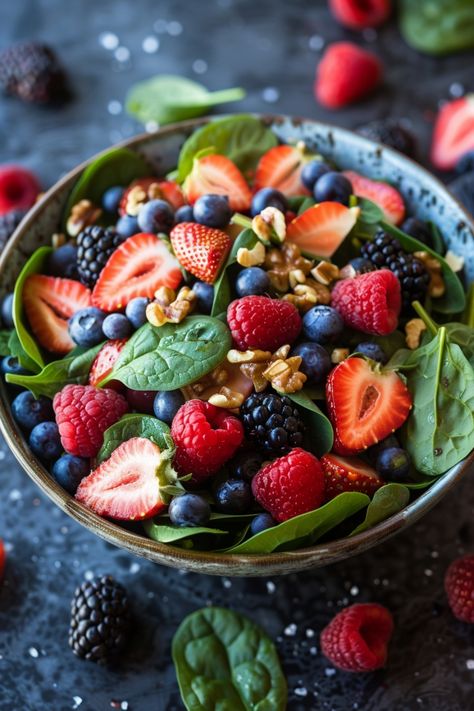 A bowl of fresh spinach salad topped with strawberries, raspberries, blueberries, blackberries, and chopped nuts. Berry Spinach Salad, Spinach And Strawberry Salad, Salad With Berries, Spicy Garlic Shrimp, Cauliflower Pizza Crust Recipe, Spinach Salad Recipes, Berry Salad, Creamy Mac And Cheese, Healthier Food