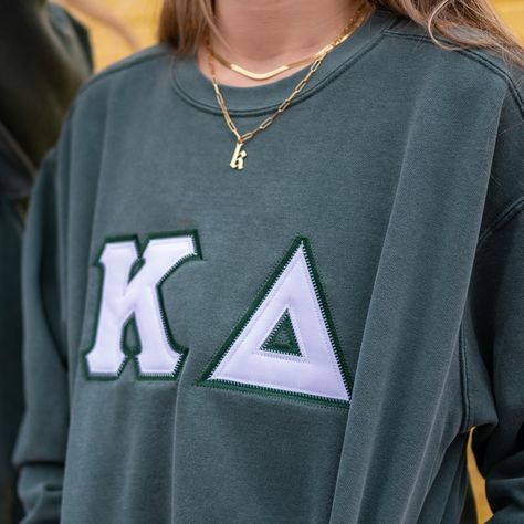 This unique & trendy Basic Greek Letter Comfort Colors Crew Neck Sweatshirt is sure to stand out on any campus!  Grab one for you, your favorite sister, or a group of sisters (chapter discounts offered - see below for more information). Pictures Featuring:  1-2. Blue Spruce sweatshirt w/ Dark Green background fabric color & White top fabric color  3. Grey sweatshirt w/ White background fabric & Light Pink top fabric AND White sweatshirt w/ White background fabric & Light Pink top fabric 4. Grey sweatshirt w/ White background fabric & Light Pink top fabric 5. Violet sweatshirt w/ Black background fabric & White top fabric 6. Blue Jean sweatshirt w/ Navy background fabric & White top fabric color There are 5 parts to your Greek Letter Sweatshirt: 1. T-shirt Color 2. T-shirt Size 3. Top Fabri Fraternity Letters Sweatshirts, Sewn Ons Sorority, Sorority Sweater Letters, Letters Sorority Sweatshirt, Sorority Block Letters Shirts, Diy Sorority Sweatshirt, Letter Shirts Sorority, Sorority Letters Shirt, Stitched Letters Sorority