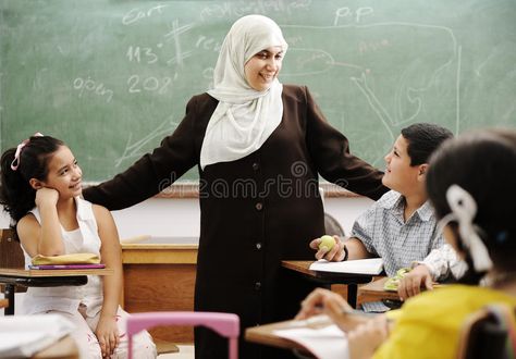 Muslim female teacher with children in classroom. In modern school , #Affiliate, #teacher, #female, #Muslim, #children, #school #ad Muslim Teacher, Ideal Classroom, Teacher Lifestyle, Modern School, Teacher Cartoon, World Teachers, Female Teacher, Study Pictures, Happy Teachers Day