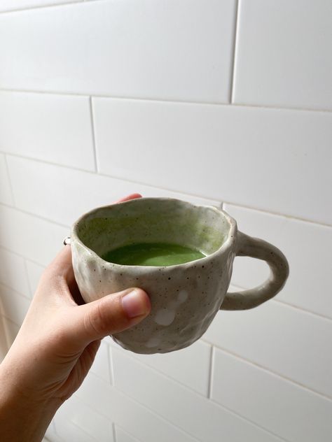 A lumpy hand-pinched mug pairs great with my morning matcha latte💚 Pinch Pots Mugs, Simple Handbuilding Pottery, Ceramic Pinch Pot Mugs, Ceramic Mug Pinch, Handmade Ceramics Aesthetic, Pinch Pot Coffee Mugs, Handmade Coffee Mug, Hand Pinched Mugs, Hand Pinched Pottery