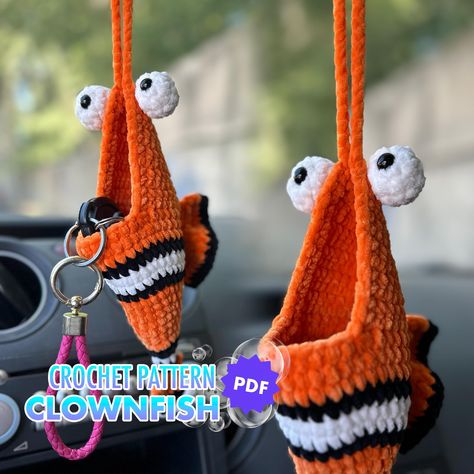 🐟Funny CAR HANGING STORAGE crochet pattern written in English with US standard terms This a pattern for a cute clown fish rear wiew mirror hanging organizer. You can also use it as a nursery decor or any other room at your house. This hanging storage can aso be used as a planter! ⭐️Materials : *Any 5-Bulky (Chunky) weight chenille yarn I used Premium Yarns Baby Love 50 60 m / 50 g (66 yds / 1.75 oz) #363 - 1 skein #316 - 1 skein #311 - 1 sekin *4 mm crochet hook *10 mm safety toy eyes *Stitch m Crochet Car Storage, Crochet Things For Your Car, Crochet Truck Accessories, Crochet Car Stuff, Car Hanger Crochet Pattern Free, Funny Car Decor, Crochet Car Hanging Pattern, Crochet Car Hangers, Crochet Car Dangles