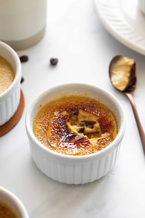 Coffee Creme Brulee is a simple recipe with a creamy, light interior and a caramelized, torched topping. Perfect for celebrations any day of the year. Learn how to make an easy, homemade Creme Brulee that will soon become your favorite. #cremebrulee #coffee #coffeecremebrulee #easydesserts #fancydesserts #datenightdesserts Coffee Creme Brulee, Caramel Creme Brulee, Creme Brulee Recipe, Brulee Recipe, Creme Brûlée, Slow Cooker Desserts, Simple Recipe, Gluten Free Desserts, Pavlova