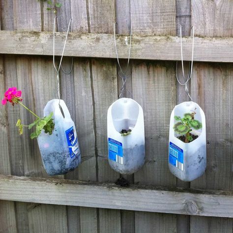 plastic milk jug flower planters Jug Planters, Wire Clothes, Laundry Detergent Container, Yard Crafts, Apartment Gardening, Plastic Bottle Planter, Detergent Container, Plastic Milk Bottles, Preschool Garden