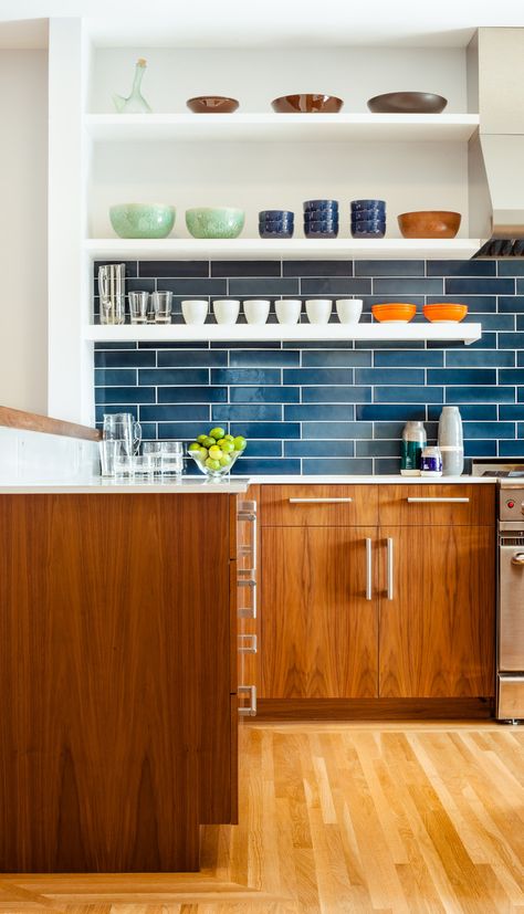 The residents have a particularly strong sense of color and love to cook with their son, so no-fuss finishes likes these blue tiles from Heath Ceramics were an ideal choice. The tiles combine with colorful tableware and custom walnut cabinetry to make a vibrant inteiror. Minimalist Dekor, Blue Backsplash, Fresh Kitchen, Kitchen Backsplash Designs, Mid Century Modern Kitchen, Blue Tile, Kitchen Splashback, Kitchen Tile, Kitchen Tiles Backsplash