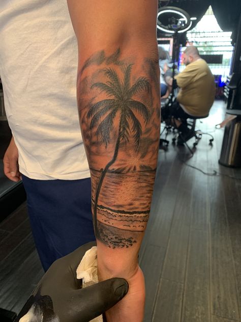 Palm tree, beach , and sunset tattoo Palm Tree Sleeve, Name Tattoo Placement Men, Island Palm Tree Tattoo, Beach Life Tattoo, Palm Beach Tattoo, Palm Tree Tattoo Ideas, Palm Tree Tattoo Men Arm, Evolving Tattoo Ideas, Palm Tree Tattoo Men Forearm