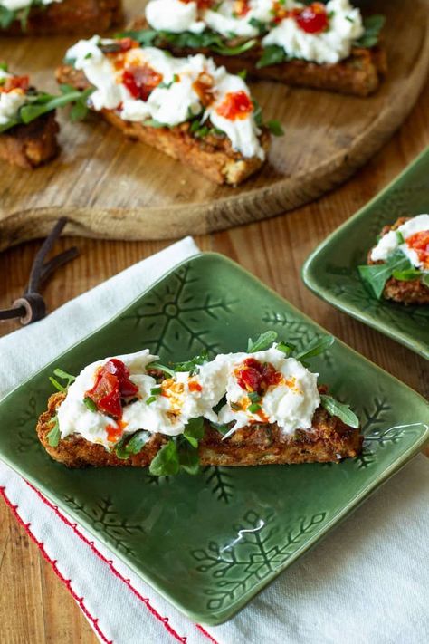 Easy Sun-Dried Tomato Pesto and Burrata Crostini is a tasty combination of toasted bread, bright tomato pesto, and creamy cheese that is hard to resist. Pesto And Burrata, Burrata Crostini, Sun Dried Tomato Pesto, Toasted Bread, Tomato Pesto, Creamy Cheese, Dried Tomatoes, Sun Dried, Sun Dried Tomato