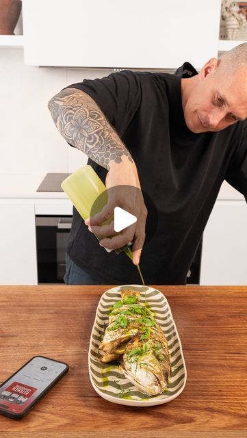 Andy Cooks on Instagram: "#ad Roast snapper with lemon, herbs and basil oil - another great recipe from Anthony Bourdain’s Kitchen Confidential. Check it out on @audible_au , the link is in my bio and start your 30-day free trial. #audible #food #fish #recipe Roasted whole snapper Ingredients: - 1 snapper, scaled, gutted, and fins removed - salt and pepper, to taste - 1/2 lemon, sliced (about 1.5 ounces/40 grams) - 2 cloves garlic, sliced - a few sprigs of rosemary - a few sprigs of thyme - 4 tbsp (60 ml) olive oil - parsley, for garnish - basil, for garnish - basil oil, for garnish Method: 1. Preheat your oven to 240°C (464°F). 2. Prepare the snapper: ensure it’s clean, with scales and fins removed. Wash well and pat dry. 3. Season the snapper with salt and pepper, covering both the ou Grilled Snapper Fillet Recipes, Red Snapper Lemon Butter Sauce, Whole Yellow Tail Snapper Recipe, Baked Red Snapper With Garlic And Herbs, Red Snapper Photography, Andy Cooks, Food Fish, Basil Oil, Kitchen Confidential