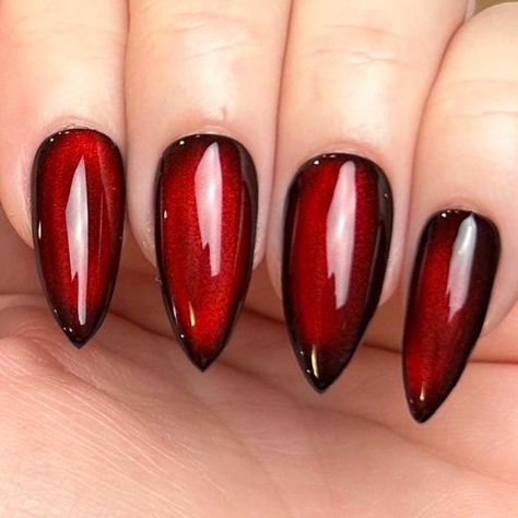 Pictured in medium stiletto and medium square.  Black Apres Gel X press-on nails with silver reflective cat eye topped with blood red jelly color gel. Looks completely black until the light hits just right, revealing a striking blood-red hue, almost appearing as if it's lit from within. Please note: colors and shine will vary depending on photography, lighting and angles. --MATERIALS AND CRAFTSMANSHIP-- This set is crafted with meticulous care using high-quality UV gel materials, including Après Black Cherry Cat Eye Nails, Red Reflective Nails, Blood Red Cat Eye Nails, Red Black Chrome Nails, Red And Black Cat Eye Nails, Red And Black Chrome Nails, Red Moon Nails, Moulin Rouge Nails, Black And Red Cat Eye Nails