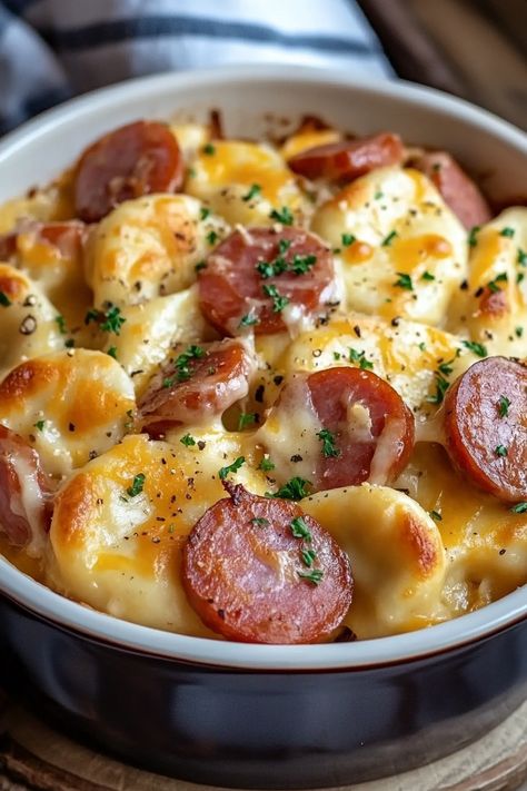 Crockpot Pierogi Casserole with Kielbasa - If there's one dish that has become a staple in my home during the colder months, it's this Crockpot Pierogi Casserole with Kielbasa. Just the thought of tender pierogies layered with savory kielbasa, all slow-cooked to perfection in a creamy sauce, takes me back to family gatherings at my Crockpot Sausage And Perogies, Keilbasa Perogie Crockpot, Kielbasa And Pierogie Bake, Pierogies And Kielbasa Casserole Oven, Sheet Pan Kielbasa And Pierogies, Kielbasa Pierogi Casserole, Pierogi Casserole Crockpot, Perogies In Crockpot, Baked Pierogi Casserole