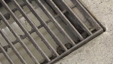 How to Install a Grate & Drain Trench in Front of a Garage Door | HomeSteady Drainage Grates, Trench Drain, French Drain, Floor Drains, Garage Floor, Garage Door, Garden And Yard, Drain, Garage Doors