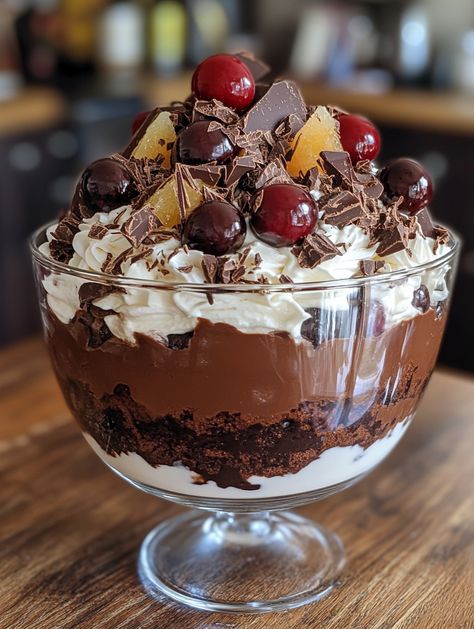 Ingredients 🥛 600g dark chocolate (finely chopped, plus extra to serve) 🍫 600mL thickened cream 🥛 750g cherries (pitted) 🍒 1 ½ tbsp caster sugar 🍬 1 ½ orange (finely grated rind and juice) 🍊 600g chocolate cake (crumbled) 🍰 1 cup caster sugar 🍬 ¼ cup water 💧 𝗠𝗲𝘁𝗵𝗼𝗱: 1. Prepare the Chocolate Mousse: In a glass bowl over a saucepan of simmering water, stir the chopped chocolate until melted (2-3 minutes). Cool briefly. Whisk the cream in an electric mixer until soft peaks form. Black Forest Trifle, Cherry Trifle, Trifle Bowl Recipes, Thickened Cream, Trifle Dessert Recipes, Trifle Bowl, Trifle Desserts, Trifle Recipe, Sweet Snacks Recipes