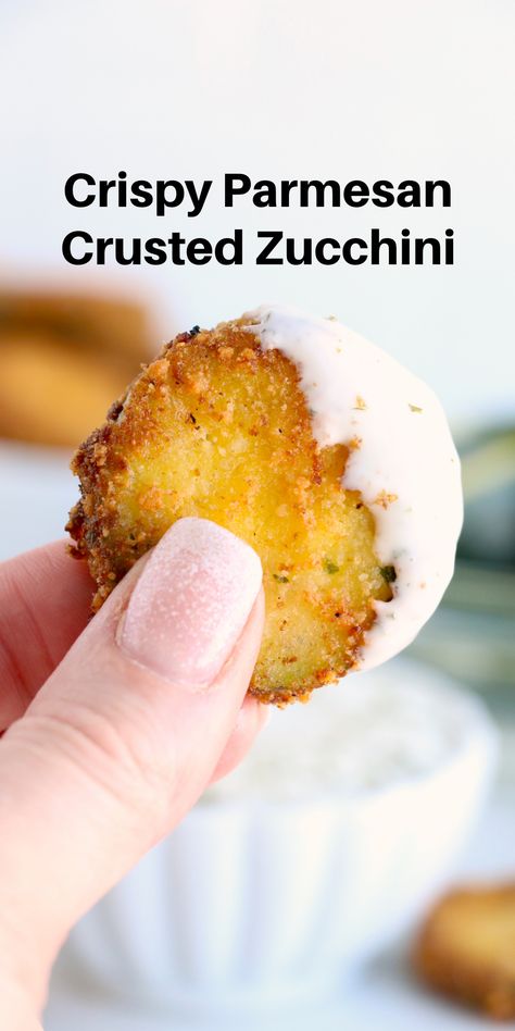 A picture of a crispy zucchini chip dipped in ranch dressing. Zucchini Garlic Bites, Parmesan Zucchini Bites, Garlic Bites, Fried Zucchini Recipes, Parmesan Crusted Zucchini, Zucchini Crisps, Zucchini Bites, Easy Zucchini Recipes, Bake Zucchini