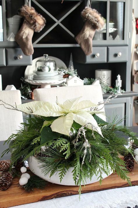 Beautiful DIY Christmas centerpiece with poinsettias and fresh greenery. It's quick and inexpensive to make and can easily be customized to any color scheme. #christmascenterpiece #christmasdecor #christmasdecorations #poinsettia #freshgreenery Poinsettia Centerpiece, Healthy Christmas Snacks, White Poinsettia, Christmas Centerpieces Diy, Christmas Kitchen Decor, Christmas Mason Jars, 2022 Christmas, Christmas Centerpiece, Christmas Jars