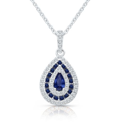 Classic and sophisticated, this Kallati blue sapphire and diamond pendant necklace boasts a timeless design. Crafted in 14k white gold, this pendant a 5x3mm pear-shaped blue sapphire gemstone that is surrounded by rows of sparkling round diamonds and round blue sapphire gemstones. The diamonds are 1/5ctw, I in color, and I1 in clarity. This necklace measures 18 inches in length. Custom Pendant Necklace, White Gold Pendant Necklace, Custom Pendant, Wedding Day Jewelry, Blue Sapphire Gemstone, White Gold Pendant, Custom Pendants, Blue Necklace, Diamond Pendant Necklace