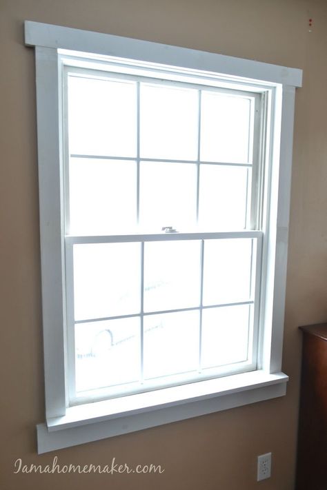 See how I turned my old, tired windows into a fun farmhouse style at http://www.iamahomemaker.com/farmhouse-window-trim/ Faux Transom Window, Simple Window Trim, Trim For Windows, Craftsman Trim Window, Farmhouse Window Trim, Window Molding Trim, Custom Window Seat, Wooden Window Design, Diy Window Trim