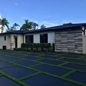 Miami Artificial Lawns | black stained driveway with artificial grass #homedecor #artificialgrass #artificiallawns #drivewaylandscape #drivewaylandscaping #driveway #concretefloors #concretedriveway Mulch Backyard, Front Yard Driveway, Grass Pavers Driveway, Patio Playground, Cement Driveway, Ground Trampoline, Grass Driveway, Permeable Driveway, Concrete Backyard