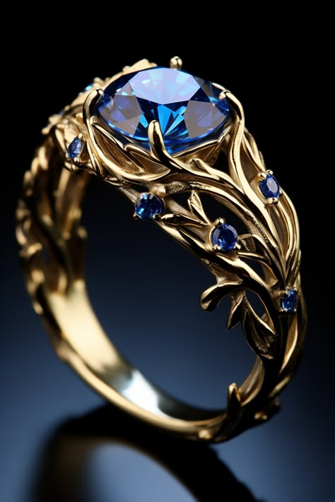 a gold ring with one big blue stone and a few smaller blue stones Fantasy Wedding Rings, Fantasy Jewelry Magic, Diy Wire Jewelry Rings, Blue Wedding Rings, Pretty Engagement Rings, Fantasy Ring, Diamond Fashion Jewelry, Cute Engagement Rings, Blue Ring