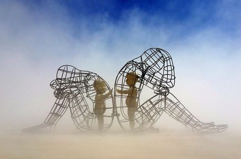 Art piece from Burning Man. A sculpture of two adults after disagreement, sitting with their backs against each other. Yet, the inner child in both of them simply wants to connect. Age has many beautiful gifts, but one we could live without is the pride and resentment we hold onto when we have conflicts with others. Burning Man Sculpture, Burning Man Art, Burning Men, Burning Man Festival, Carl Sagan, Chapter One, Inner Child, Wall Art Pictures, Posters And Prints